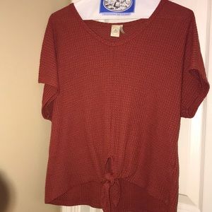 Maroon shirt with tie at the bottom